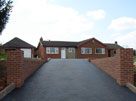 Tarmac Driveway and Brick Wall